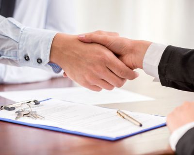 Handshake of a real estate agent and a client.